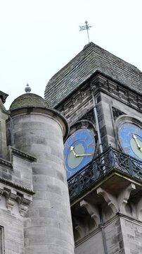 clock tower dunrobin castle medieval architecture luxurious property reflects rich history estate inverness uk panning shot scene visuals heritage aesthetics 