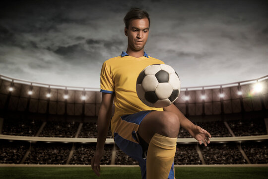 Male football player practising kick-ups