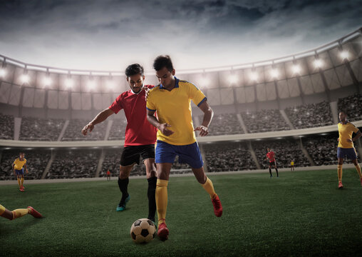 Rival Football Players in Challenge for Possession Of Football