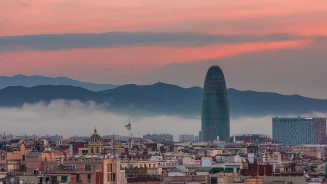BARCELONA, SPAIN - NOVEMBER 9, 2024: TL Barcelona offers sweeping views of the city skyline and iconic architecture at sunset