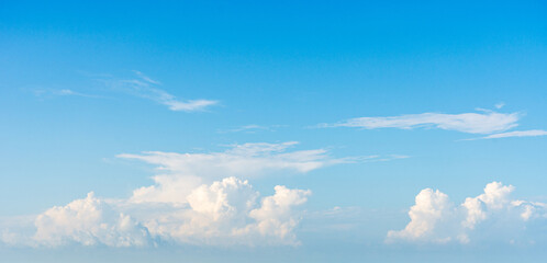 Serene Blue Sky with Fluffy White Clouds