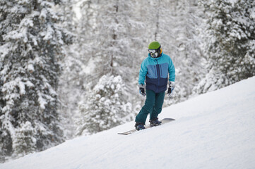 Generated imageActive snowboarder wearing vibrant winter gear enjoying a thrilling descent on a...