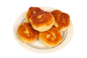Homemade pies on a plate on a white background.
