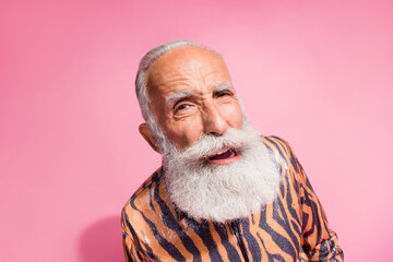 Portrait of funky aged man eavesdrop curious tiger print shirt isolated on pink color background