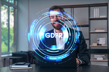 Smiling businessman in formal wear working on laptop at office workplace with smartphone and notebooks. Concept of successful business deal, agreement. datum security icons.