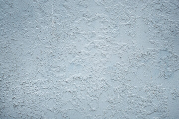 The metal surface is roughly painted as a background.