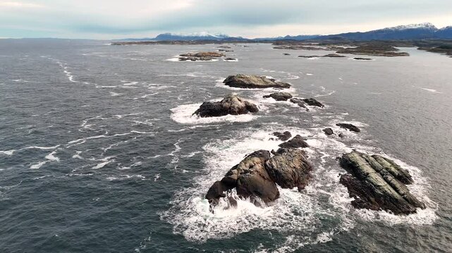 Aerial footage of the Hestskjaera reef, near Hestskjaeret lighthouse in Averoy city, Norway