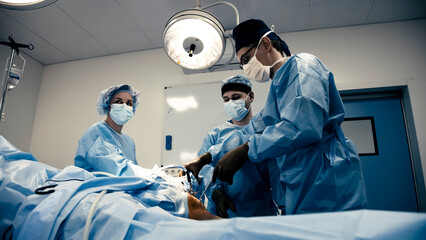 The surgeon performs endoscopic manipulations on the kneecap. The doctor performs arthroscopic...