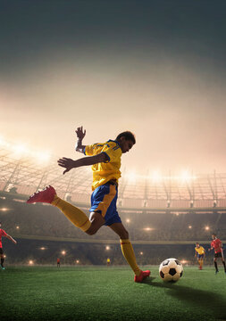 Football player shooting the ball at the goal.
