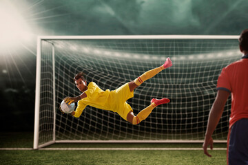 Goalkeeper catches the ball . At the stadium, in the spotlight.