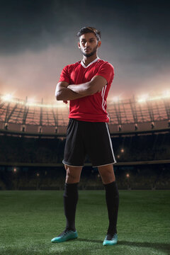 Football player standing portrait with stadium in backgorund