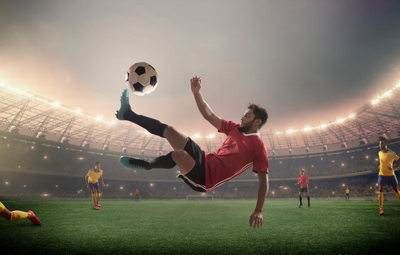 Football player bicycle kicking the football