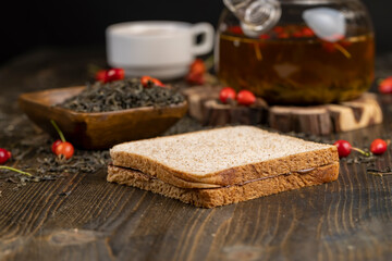 delicious sandwich of bread with chocolate on the black table