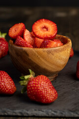 several pieces of red sweet strawberries in close-up