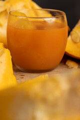 a ripe orange pumpkin with seeds and pumpkin juice cut into pieces