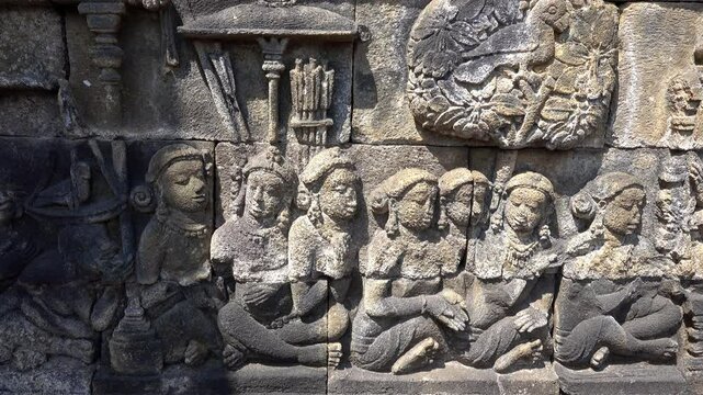 A dharma lesson illustrated in stone on the ancient Buddhist temple of Borobudur.