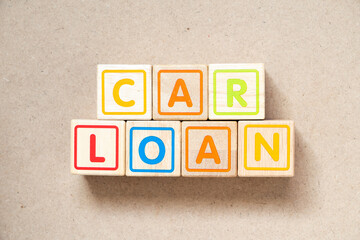 Alphabet letter block in word car loan on wood background