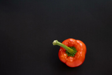 red bell pepper on black background