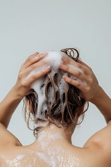 woman taking shower and washing hair with shampoo