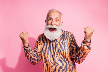Photo of positive cheerful old man scream raise winning fists wear shiny shirt isolated pastel...