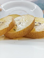 Slice of kiwi on the table