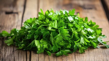 Fresh parsley leaves stacked on rustic wooden surface ideal for healthy salad recipes and culinary presentations
