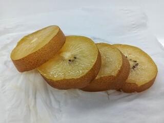 slices of kiwi fruit on the table