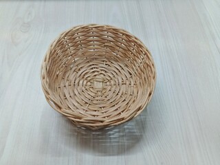 wicker basket on wooden background