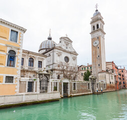 Fototapeta premium Chiesa di San Giorgio e Chesi and Bell Tower Along a Venetian Canal