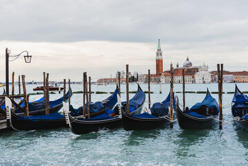 Gondolas Docked on Venetian Canal with San Giorgio Maggiore and Bell Tower