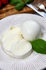 Tasty italian food, fresh white buffalo mozzarella soft cheese balls from Campania close up