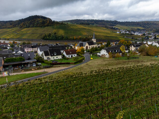 Aerial view of terraced vineyards around Nittel, Rhineland-Palatinate, Germany and views across Moselle River on vineyard hills of Machtum, Luxembourg