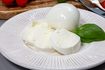 Tasty italian food, fresh white buffalo mozzarella soft cheese balls from Campania close up