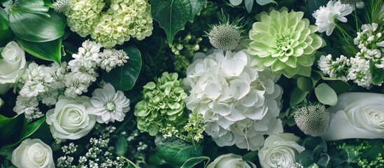 Elegant wedding decor with lush green and white floral arrangements showcasing modern and classic design elements