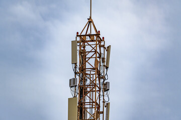 Communication tower with blue sky and clouds moving background