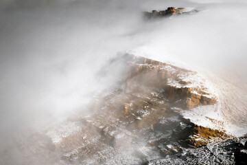Cloud falls from the rocks