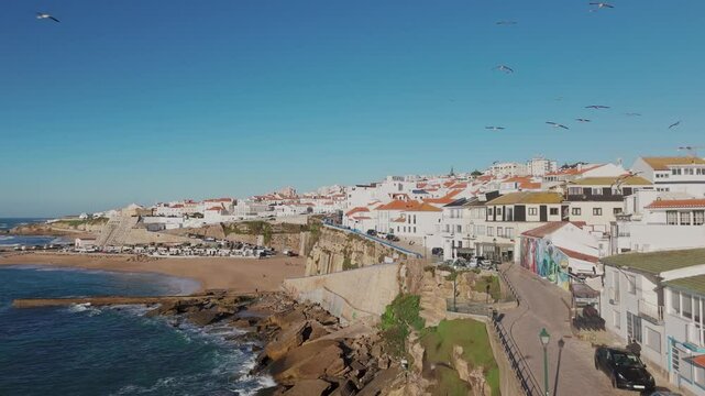 Establishing aerial shot of the coastal village of Ericeira. Portugal