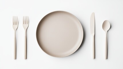 Empty plate accompanied by a spoon knife and fork on a white background Features mesh and clipping mask