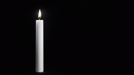 A tall white candle standing upright on a solid black background