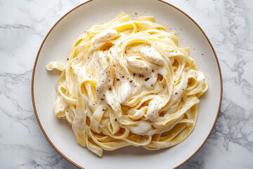 A classic plate of creamy fettuccine presented in an elegant dish.