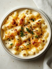 A comforting bowl filled with creamy, cheesy pasta and fresh herbs.