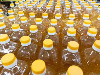 Sunflower oil bottles in close-up on a supermarket counter. Charity food. Background. Rising prices for socially important goods.