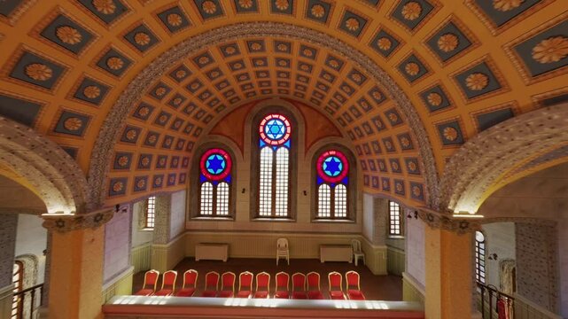 An exquisite FPV drone shot showcasing the intricate interior architecture of a historic synagogue