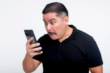 Man Expressing Shock While Looking at Smartphone Against White Background