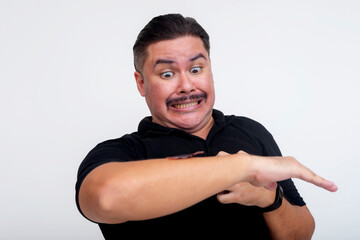 Man reacts with fear as a cockroach crawls on his arm