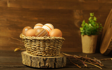 Fresh natural and painted chicken eggs. Easter composition.