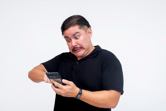 A triggered middle-aged man typing angrily on his phone, reacting to a basher or critic on social media. Reacting dramatically.