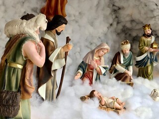 Nativity scene with family in Winter. Christmas decoration in church at India.