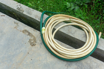 hose reel at the edge of the garden