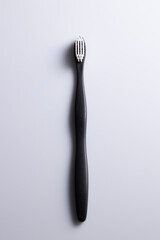 Vertical shot black and white toothbrush, isolated.
